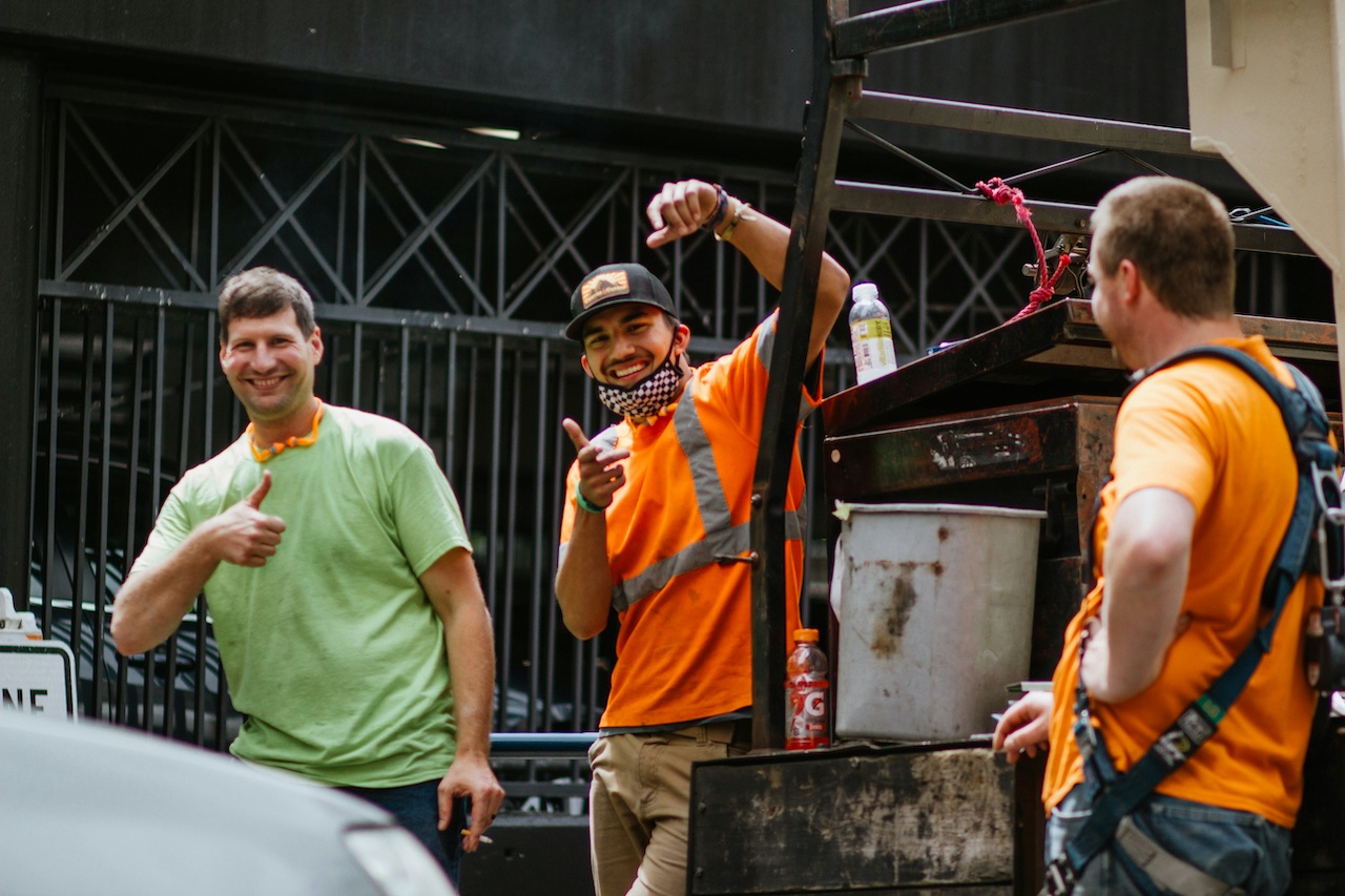 Happy construction men giving thumbs up
